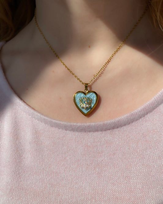 Midnight Wish Locket Necklace - Gold heart locket pendant with blue glitter enamel and iridescent crystal detail on delicate gold chain. Dainty fairycore keepsake jewelry gift for her.